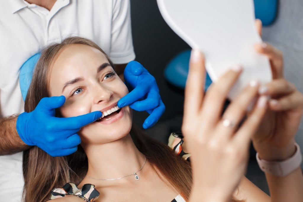 Dentist reviewing a 3D Invisalign treatment plan with a patient in Torrance, CA